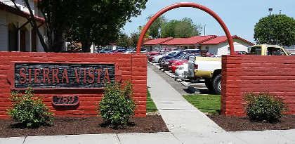A red brick wall with a sign that says Sierra Vista.