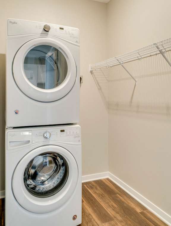 Stacked washer and dryer in laundry room at Ascend at Woodbury in Woodbury, MN