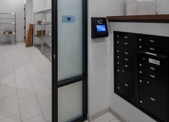 a glass door leading into a room with a mail room and a counter with mail at 2929 on Mayfair, Wauwatosa, Wisconsin