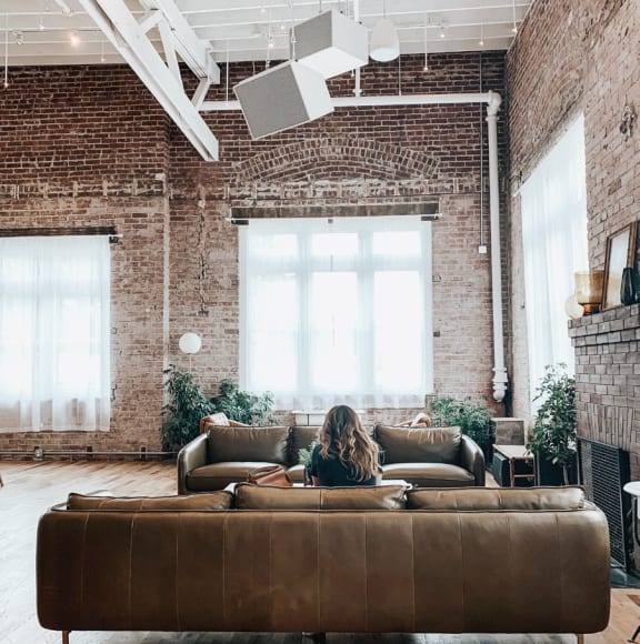 a person sitting on a couch in a living room