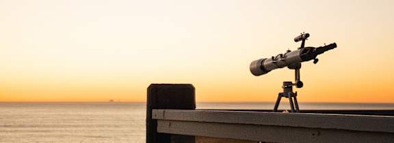 A beachfront row of houses overlooks the ocean.