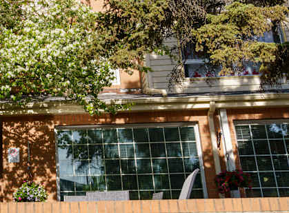 the front of a building with a sign that reads friendship manor
