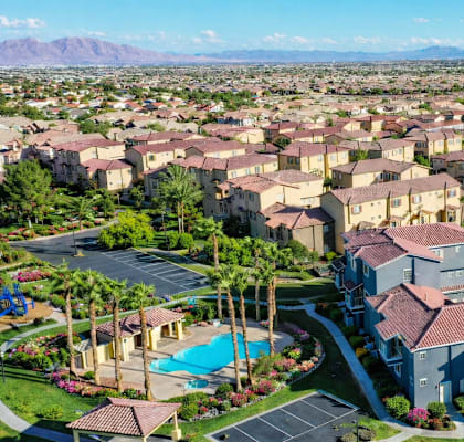 A large residential area with houses and a pool.