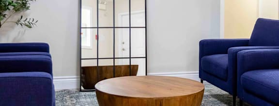 A modern dining room with a wooden table and chairs.