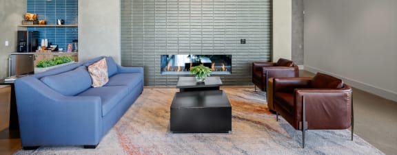 a living room with a couch and a table and a kitchen