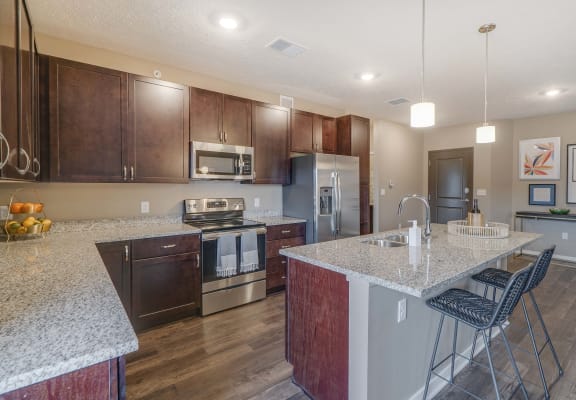 Spacious kitchens with granite countertops at The Flats at Shadow Creek new luxury apartments in east Lincoln NE 68520