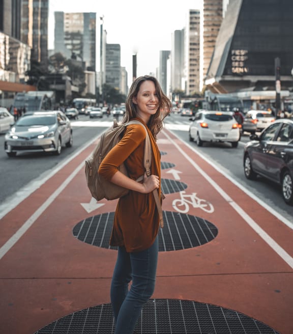 portrait of a young woman standing in the middle of a city street at NoMa Apartments, California, 94596