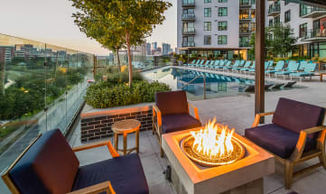 Poolside Entertainment Area With Firepit at 1000 Speer by Windsor, Denver, Colorado