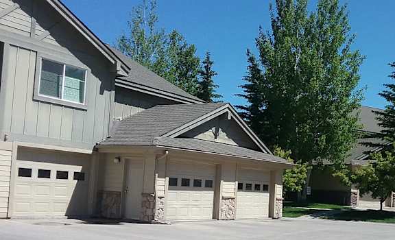 Image of front of building, garages, and parking