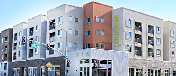 A street view of a multi-story building with the name "Parklands" on the side.