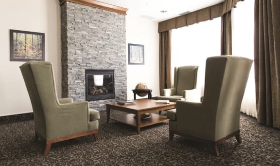 a living room filled with furniture and a fireplace