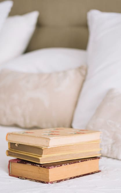 Books near pillows