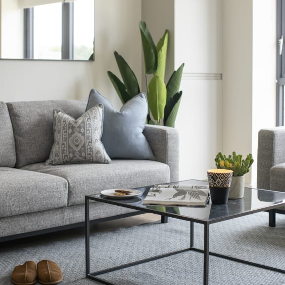a living room with a couch and a coffee table
