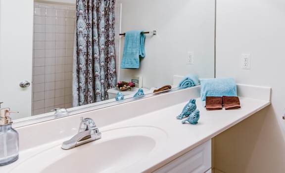 The Fairway Apartments bathroom with oversized mirror