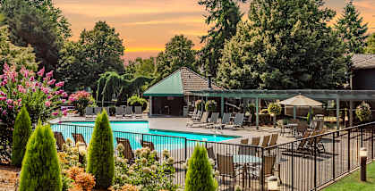 Kings Court apartments seasonal pool exterior fence at sunset