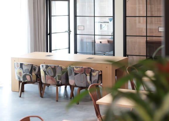 a dining room with a wooden table and chairs at Hawkins Press, Charlotte, NC