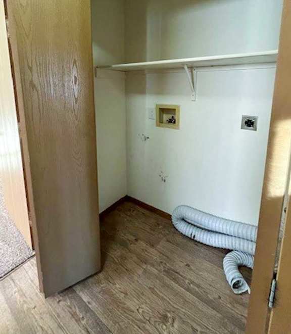 a laundry closet with washer and dryer hookups