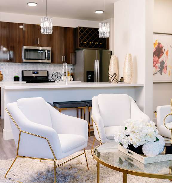 A dining room with a table set for a meal.