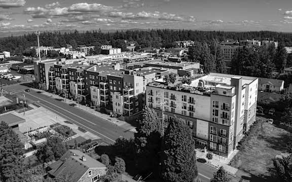 an aerial view of a city with tall buildings and trees