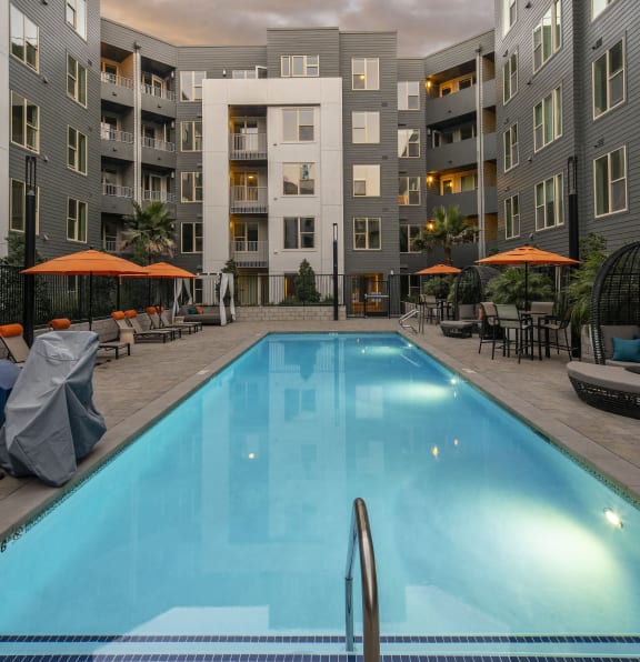 a swimming pool in the middle of an apartment building