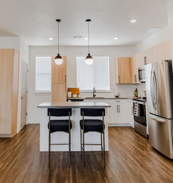 a kitchen and dining area in a 555 waverly unit