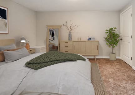 a bedroom with a bed and a dresser and a closet
