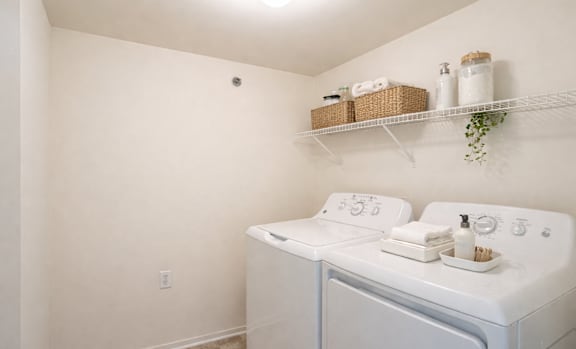 A laundry room with a washer and dryer.