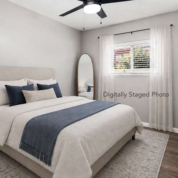 Room with a ceiling fan and wooden flooring. at OSM Properties Homes & Apartments, Chico, CA 95926