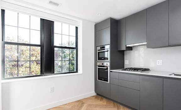 Brand new renovation! Studio apartment kitchen with gas range, dishwasher, built in microwave and oven.