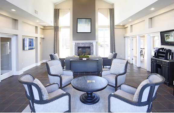 A living room with a fireplace and a television.
