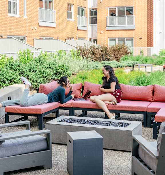 a group of people sitting around a table in a restaurant at Hot Metal Flats apartments, Southside Pittsburgh, PA