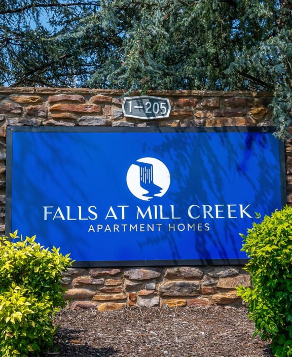 falls apartment homes sign at the entrance of the property
