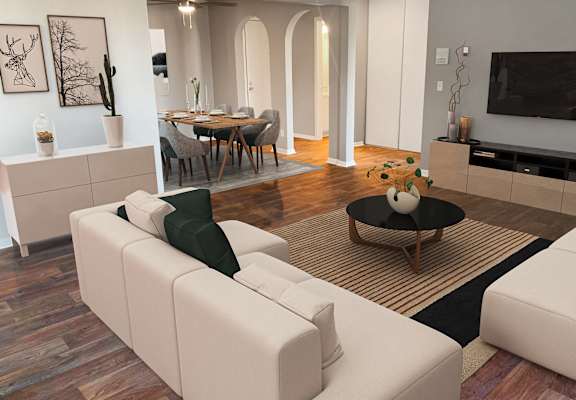 Living room with view into kitchen spacious layout with plank wood flooring, grey walls, and couch and seating. Trendy archway architecture throughout, apartment with plank wood flooring throughout.