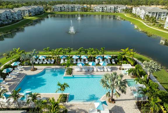 Resort-Style Heated Pool and Lake at Everly Luxury Apartments in Naples, Florida