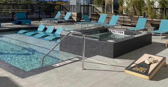a rendering of an apartment building with a swimming pool