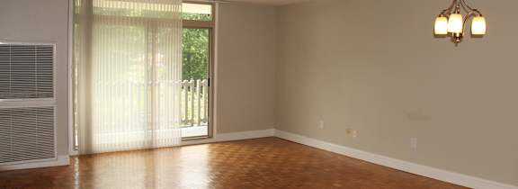 an empty living room with wood floors at Renew Worcester, Worcester, MA, 01602