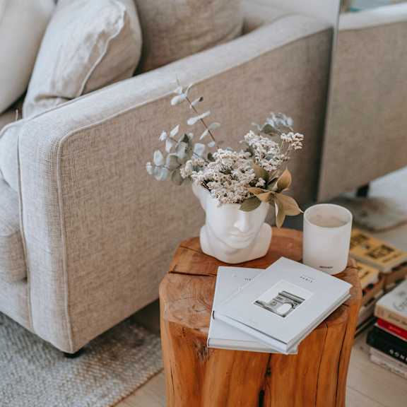 Living room filled with furniture and a large mirror.