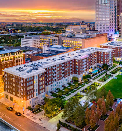 an aerial view of the city at sunset