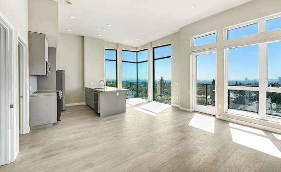 A spacious kitchen with a view of the city at Skyview Sunset Apartments, Los Angeles, CA