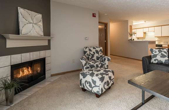 A living room with a fireplace and a couch.