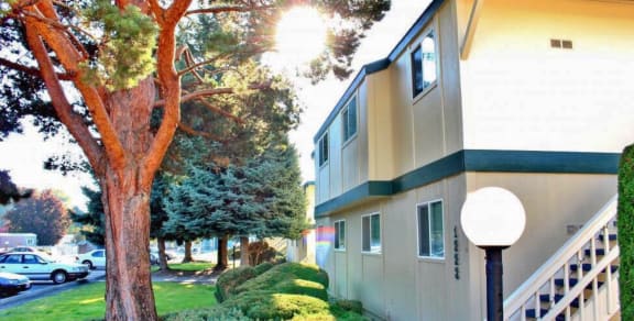 La Verde Apartments Building Exterior with Landscaping and Trees