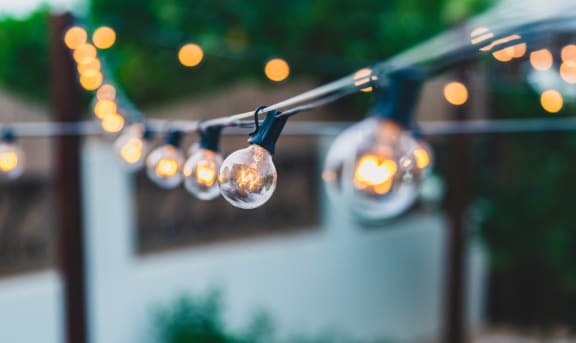 a string of lights hanging from a patio