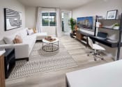 Thumbnail 18 of 24 - Furnished Living Room with Plank Luxury Flooring, Door to Patio and a Window at NoMa Apartments, California, 94596