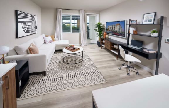 Furnished Living Room with Plank Luxury Flooring, Door to Patio and a Window at NoMa Apartments, California, 94596