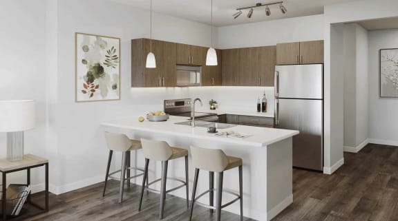 a kitchen with an island and bar stools in a living room