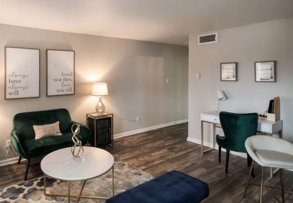 a living room with couches and chairs and a table at Seacrest Apartments, Texas, 75044