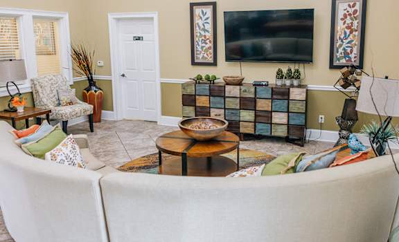 a living room with a couch and a television