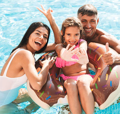 a family in a swimming pool