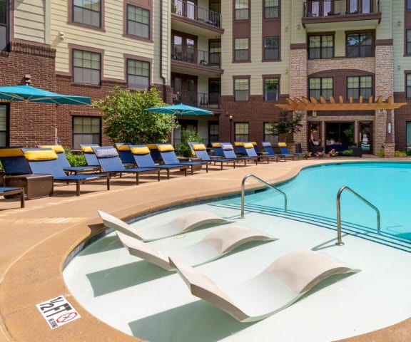 Swimming pool with tanning ledge with chairs, 1010 Dilworth, Charlotte, NC