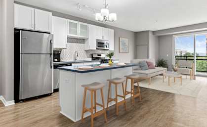 A kitchen with a refrigerator, stove, and bar stools.